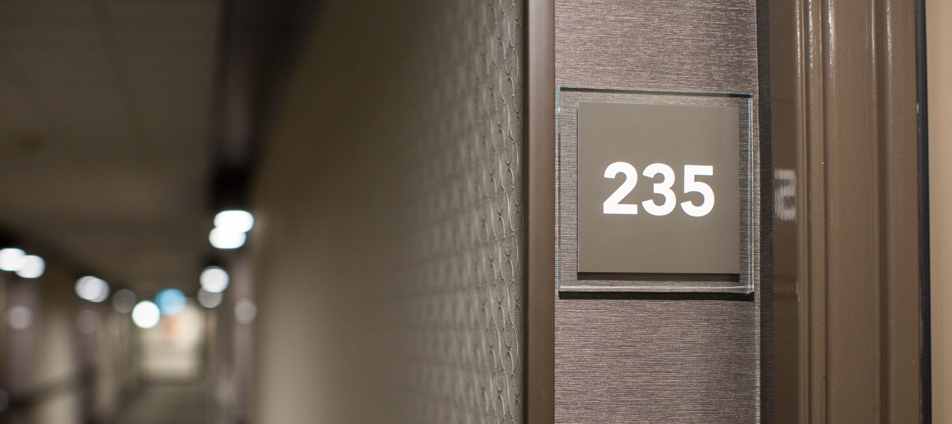 A close up of the door to a building with a sign
